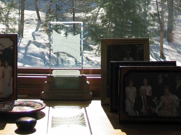 Spectra sundial amongst family portraits on a snowy day